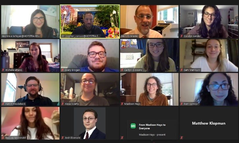 Screenshot of a zoom video conference with 16 smiling participants